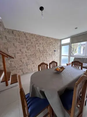 a dining room with a table and chairs at Duplex Independencia in Villa Carlos Paz