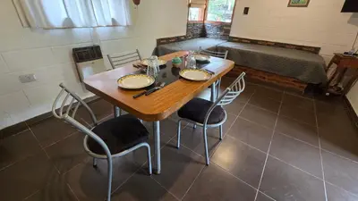 a table and chairs in a room with a bed at La Pasionaria in La Rancherita