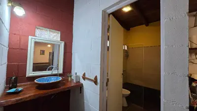 a bathroom with a sink and a mirror at La Pasionaria in La Rancherita