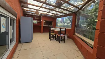 a kitchen with a table and chairs in a house at La Pasionaria in La Rancherita