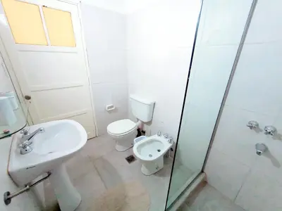a bathroom with a toilet and a sink and a shower at Artigas Confort - Bienes Reales in Cordoba