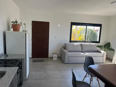 a living room with a couch and a table at Lago de montaña in Villa Carlos Paz