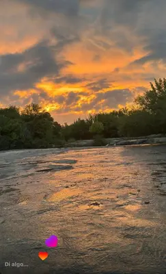a river with two pieces of paper in the water at La Caballeriza Hostel in Tanti Nuevo