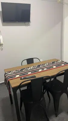 a table with a blanket on top of it at Departamento VILLA CARLOS PAZ 3P in Villa Carlos Paz