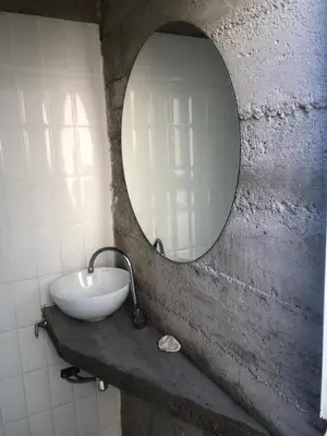 a bathroom with a sink and a mirror at Casa L in Los Reartes