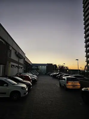 a parking lot with a lot of cars parked at Hermoso y comodo departamento Hospital Cardiologico Kempes Centro de Conveciones Cordoba in Cordoba