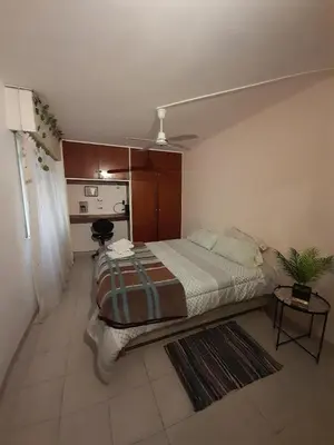 a bedroom with a large bed in a room at Exclusivo Departamento en Nva Cba!!! in Cordoba