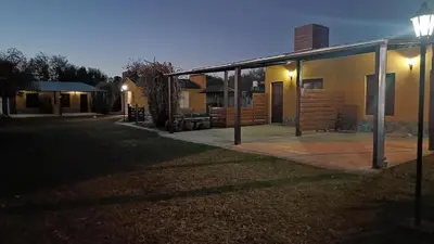 a house with a street light in front of it at Complejo Rancho Aparte in Villa Rumipal
