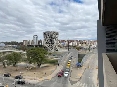 a bridge over a road in a city with cars at Departamento Matilda - B Gral Paz Cba in Cordoba