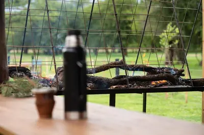 a grill with a bunch of food on it at Ayres del Golf Posada-Restó in Merlo