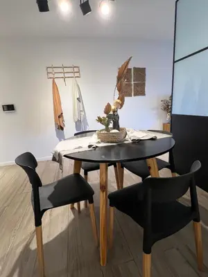 a dining room with a table and two chairs at Premium tower apart Parking gratis in Cordoba