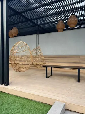 a room with a bench and a swing at Premium tower apart Parking gratis in Cordoba