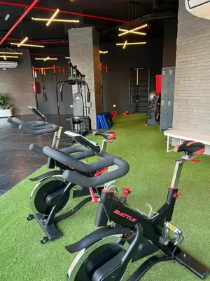 a row of exercise bikes in a gym at Premium tower apart Parking gratis in Cordoba