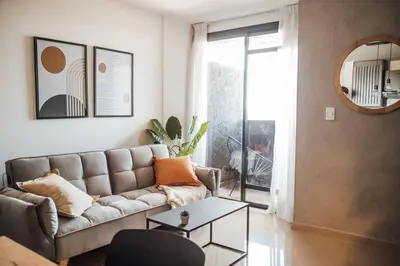a living room with a couch and a table at Tu espacio en la Cuidad in Cordoba