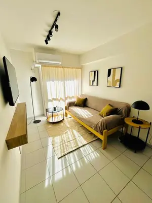 a living room with a couch and a table at Dean Funes Apartamento in Cordoba