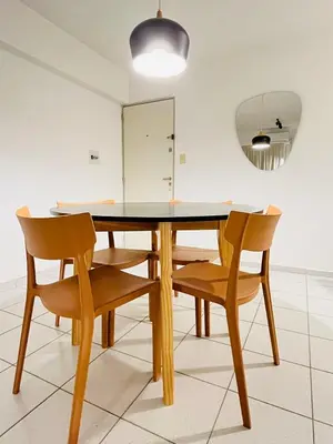 a dining room with a table and chairs at Dean Funes Apartamento in Cordoba