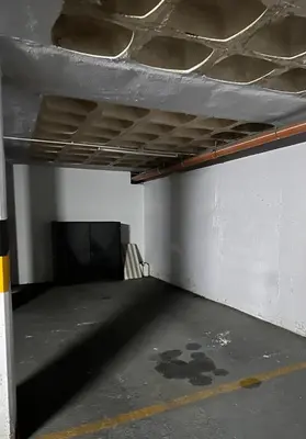 an empty parking lot with a couch in a room at Miralejos 7 Centro in Villa Carlos Paz