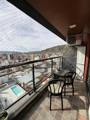 a balcony with a table and chairs and a view at Miralejos 7 Centro in Villa Carlos Paz