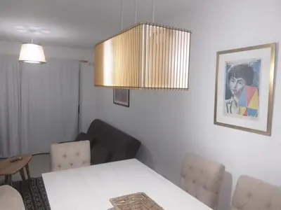 a living room with a white table and chairs at Veneto Village Departamento in Villa Parque Siquiman