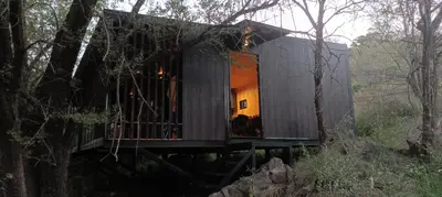 a tree house in the middle of a forest at Casita en el río, Mayu Sumaj in San Antonio de Arredondo