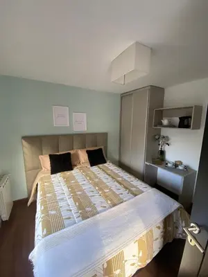 a bedroom with a large bed in a room at Descanso de Liniers in Alta Gracia