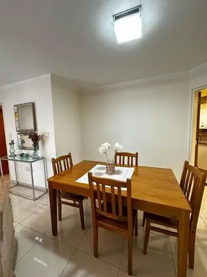a dining room with a wooden table and chairs at Lugones House in Cordoba