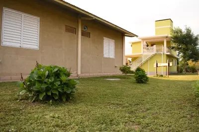 a house with a plant in front of it at Complejo BETELGEUSE in La Estancia