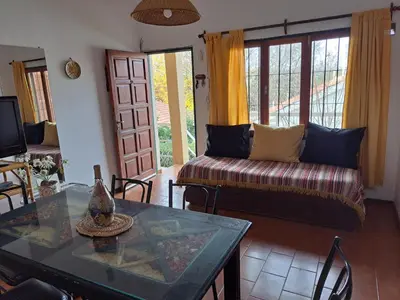 a living room with a couch and a table at Dpto BenRos 5 pax - Complejo el Escorial in Villa Carlos Paz