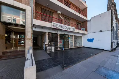 an empty street in front of a building at Calasanz in Cordoba