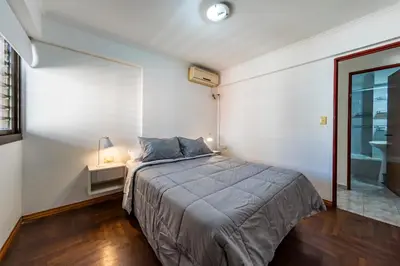 a bedroom with a large bed and a window at Calasanz in Cordoba