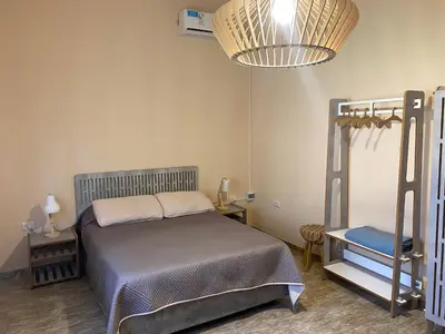 a bedroom with a bed and a bunk bed at Casa Ayacucho in Alta Gracia