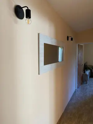 a flat screen tv on the wall of a room at Casa Ayacucho in Alta Gracia