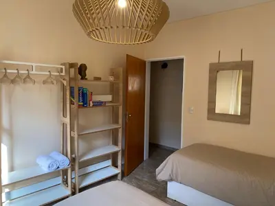 a bedroom with a bunk bed and a mirror at Casa Ayacucho in Alta Gracia