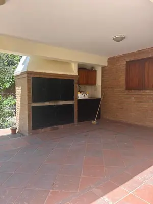 an empty kitchen with a brick wall at El Recuerdo in Merlo
