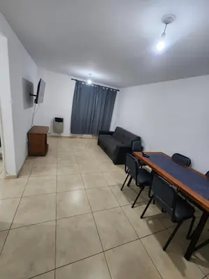 a living room with a table and a couch at Lo de Tony in Cordoba