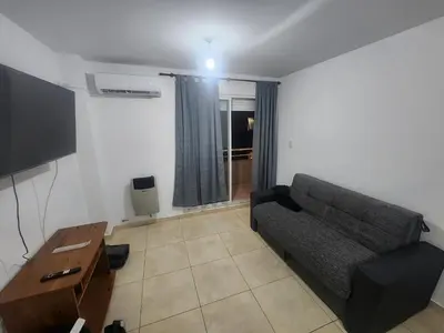 a living room with a couch and a tv at Lo de Tony in Cordoba