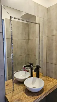 two sinks on a wooden counter with a mirror at Penthouse Calazans in Cordoba