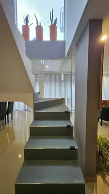 a staircase with potted plants on top of it at Penthouse Calazans in Cordoba