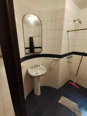 a bathroom with a sink and a mirror at Balcarce Residential Apartament in Cordoba