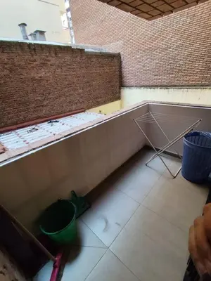 a room with a wall and a bucket on the floor at Balcarce Residential Apartament in Cordoba
