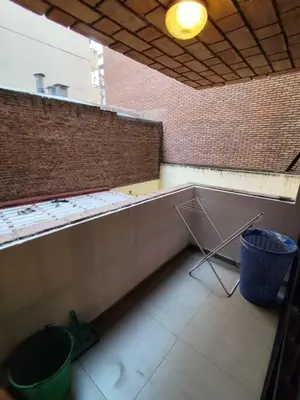 an empty room with a wall and a trash can at Balcarce Residential Apartament in Cordoba
