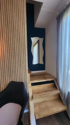 a small room with a bed and a window at Cabañas La Frontera in Villa General Belgrano