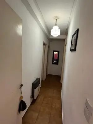 a hallway with a television on a wall at Complejo con seguridad in Cordoba