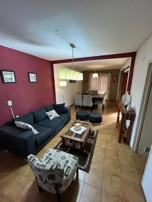 a living room with a couch and a table at Complejo con seguridad in Cordoba