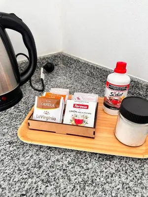 a wooden cutting board with ingredients on a counter at Departamento Estrada Lux Céntrico in Villa Carlos Paz