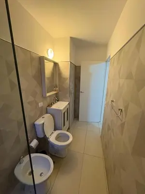 a bathroom with a toilet and a sink at Exclusivo depto en Complejo Santo Domingo con seguridad 24 hs in Cordoba