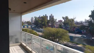 a balcony with a view of a city at Departamento en Edificio Fluss, Mariano Fragueiro 585 in Cordoba