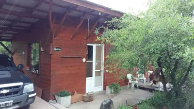 a red brick house with a white door at Alpa'y Kanki in Alpa Corral