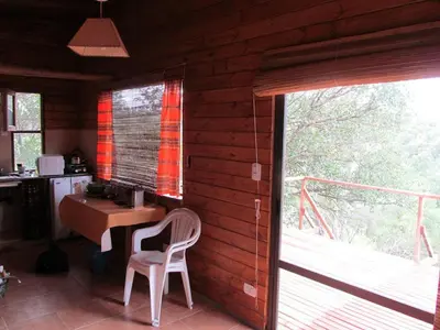 a room with a desk and a table and a window at Alpa'y Kanki in Alpa Corral