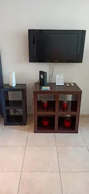a living room with a tv and a coffee table at Monoambiente excelente ubicación Cordoba Rent in Cordoba